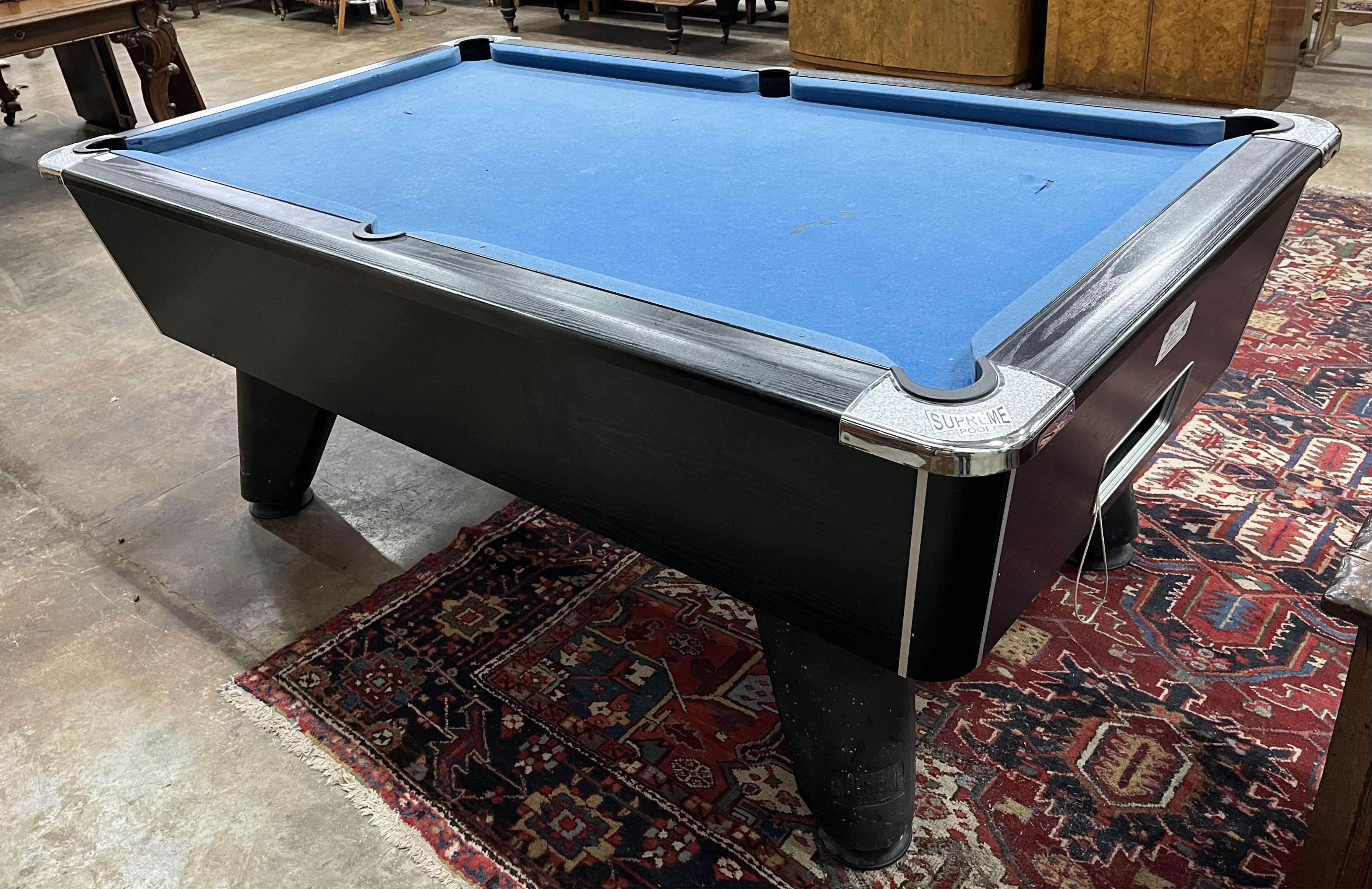 A Supreme pool table with all accessories, width 210cm, depth 120cm, height 82cm. Condition - fair, baize poor